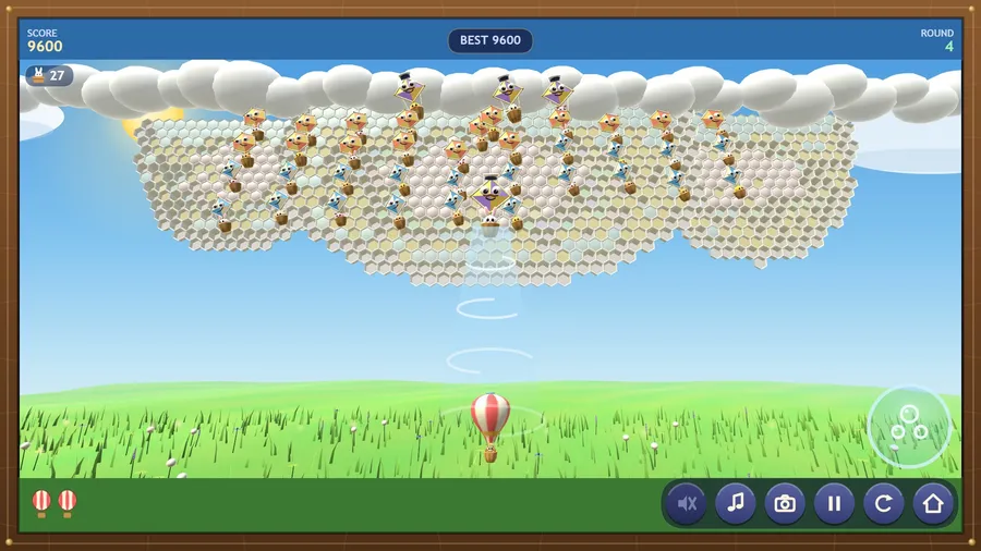 Round 4: a Captain kite in a sailor cap spins a whirlwind down toward the striped hot-air balloon; score 9600