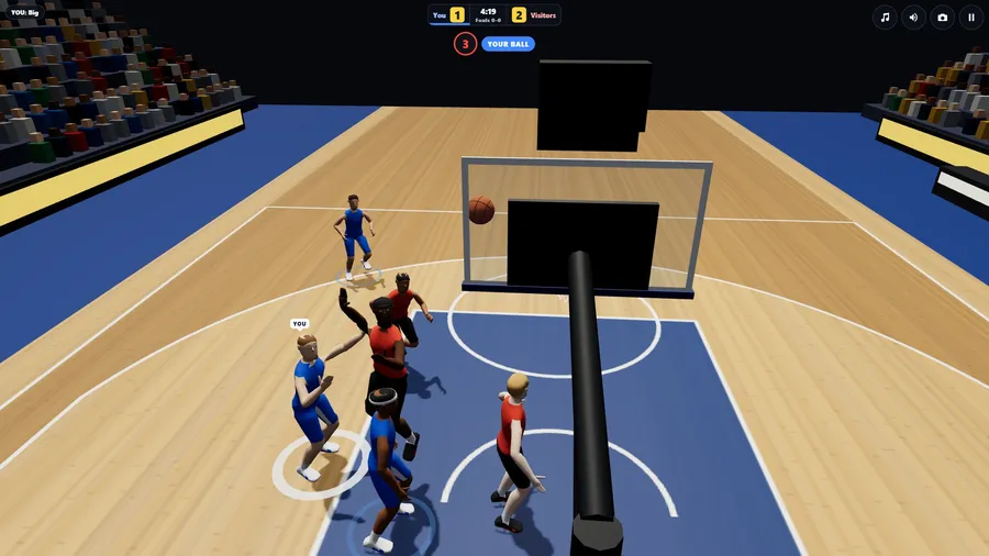 From behind the glass backboard in an arena: the ball dropping toward the ring while players below watch it, crowd beyond.