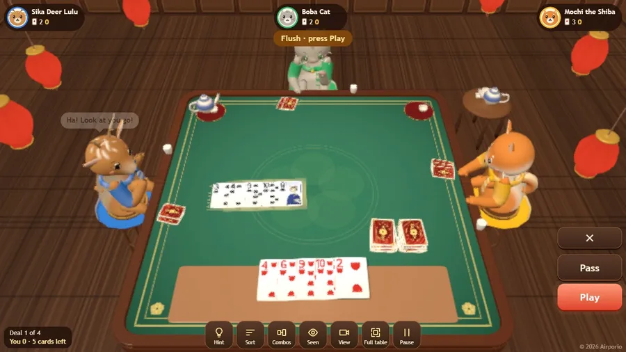 A five-card hand on the table and the five cards you chose to beat it, with Play ready.