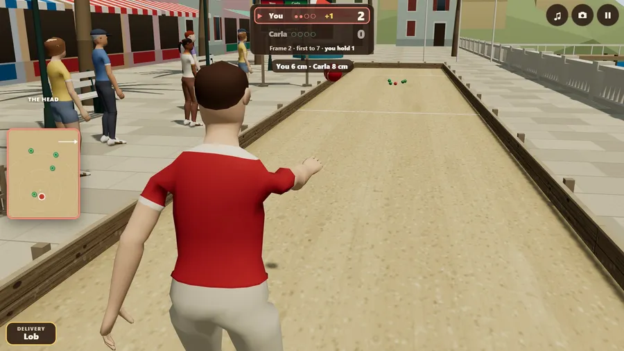 The promenade over the shoulder: the red ball has just left the open hand and flies down a sand court to the head.