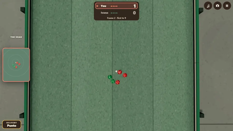 The club court from straight above at the end of a frame: red and green balls round the white pallino on green carpet.