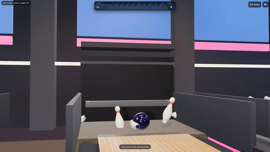 A strike on the pin deck: the ball among the rack as pins tumble and fly