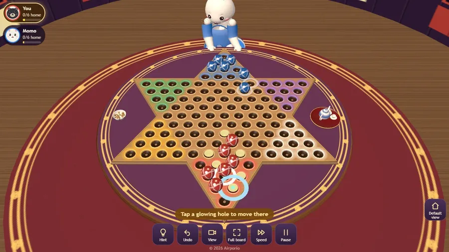 Early in a two-player game: red marbles at their start corner, one selected, gold holes showing where it can go.