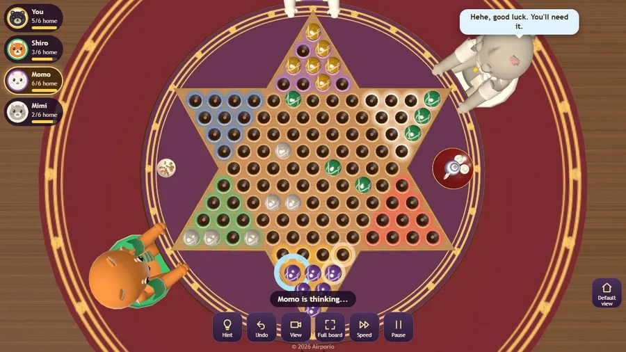 Late in a four-player game seen from above, marbles crossing to the opposite corners.