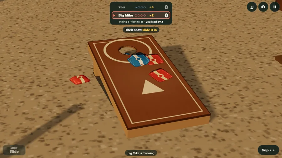 The brewery garden's board close up: a blue bag slides toward the hole beside two red bags.