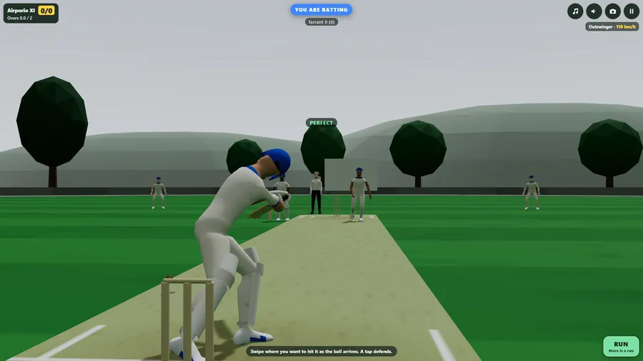 A low, close view from behind the batter at a ground among hills, as he steps forward and meets the ball.