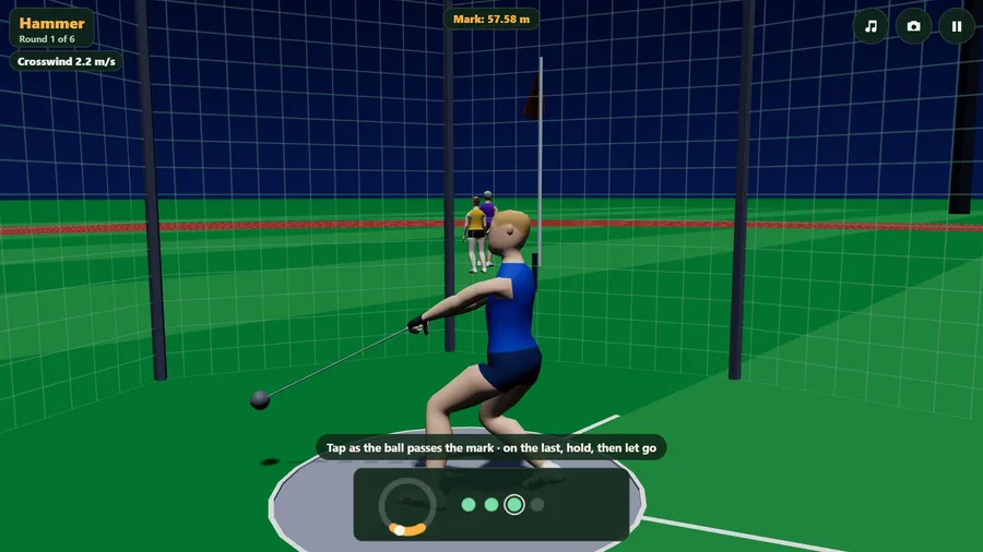 Close on a hammer thrower in blue turning inside the cage at a floodlit night meeting.