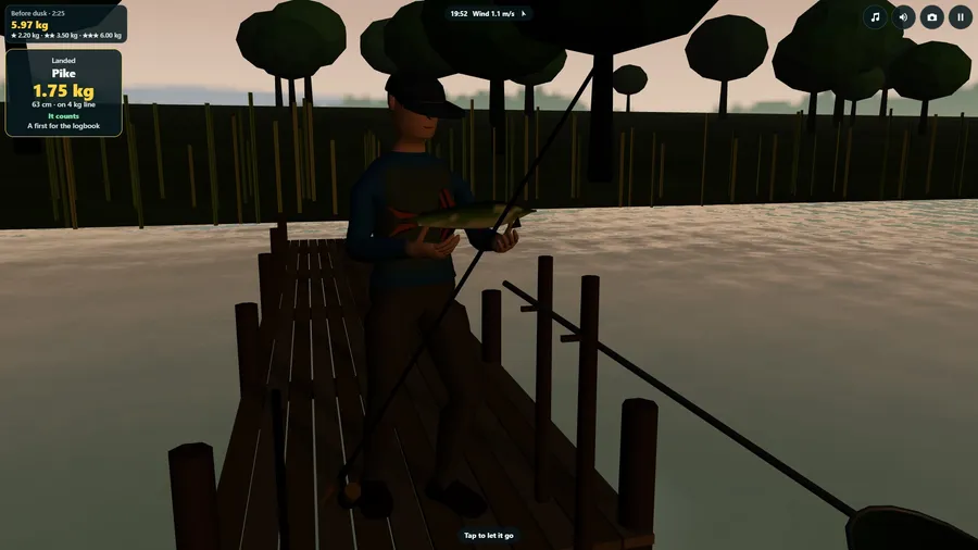 On a wooden staging at dusk an angler holds up a pike; a card gives its weight and length.