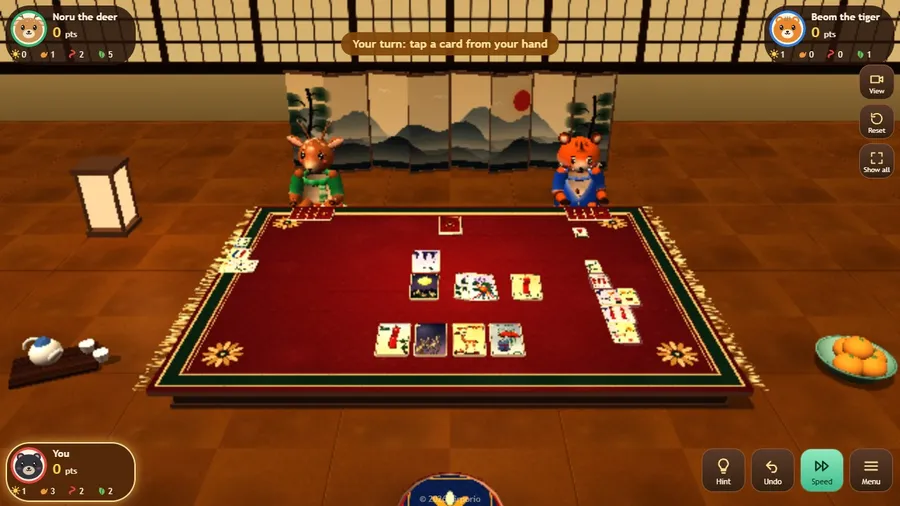 Whole room view: a tea-room with a painted screen, a lantern and a bowl of oranges, and the small card mat in the middle.