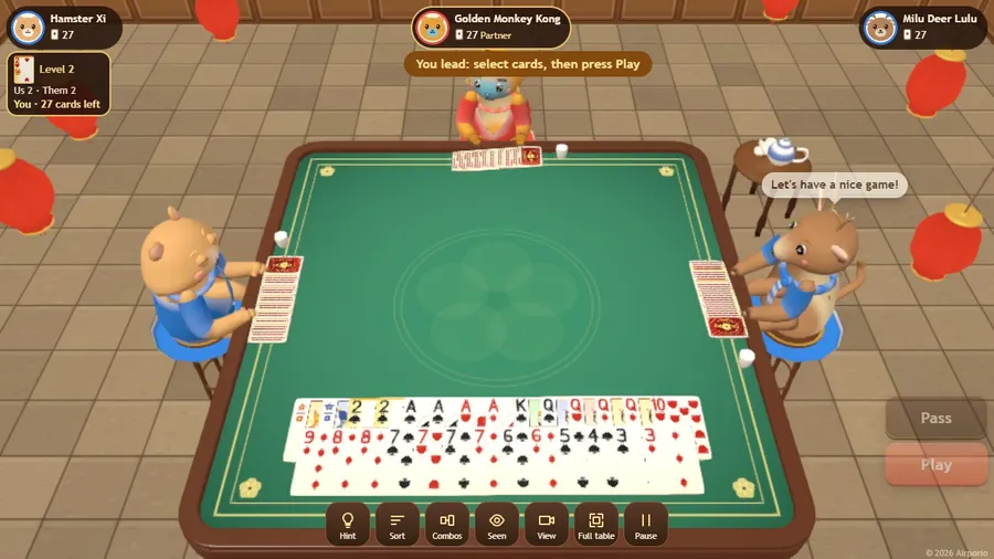 Your 27 cards flat on the felt in two rows, gold level cards and the glowing wild heart, partner across the table