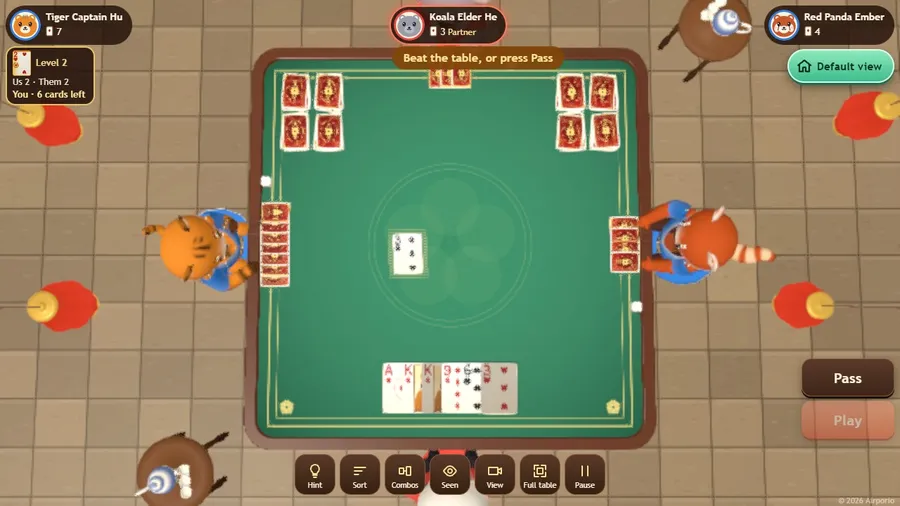 The full-table view: the whole table from above with every hand lying flat and the discard stacks