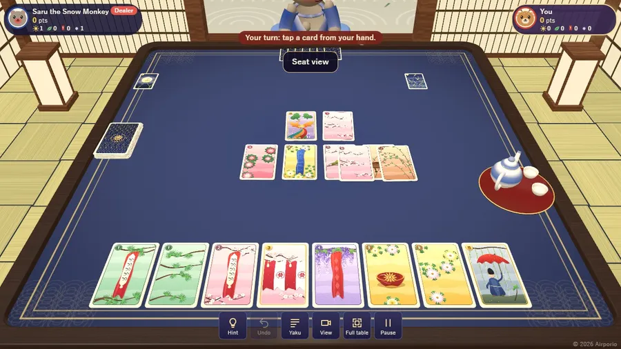 Your first turn: eight flower cards lie flat in a row at the bottom, table cards in the middle, the deck on the left.