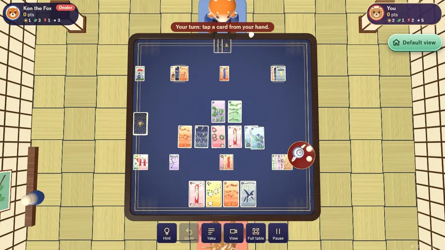 Full table view: the whole tea-room table, both animals, the deck, the table cards and every captured pile from above.