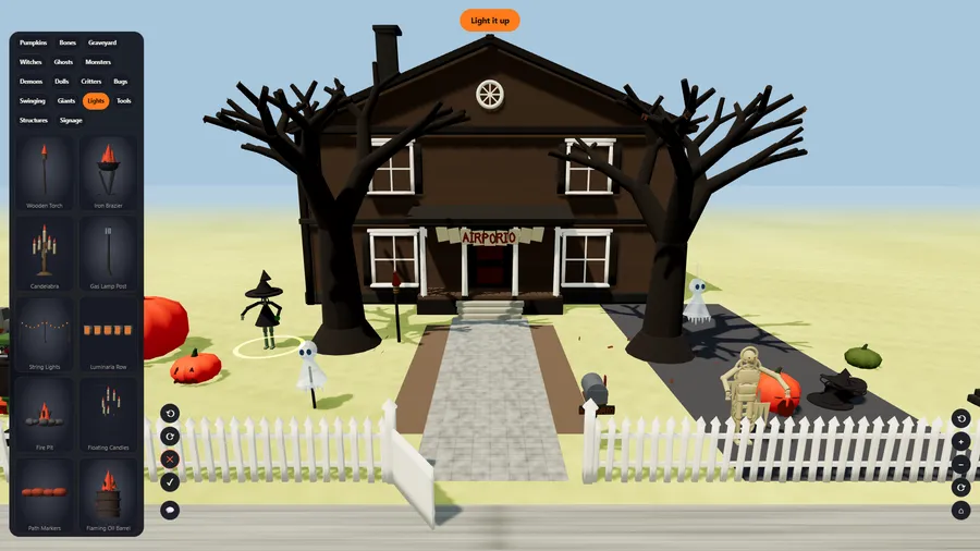 A witch decoration selected on the lawn, ringed in light, with turn, remove and done buttons beside it