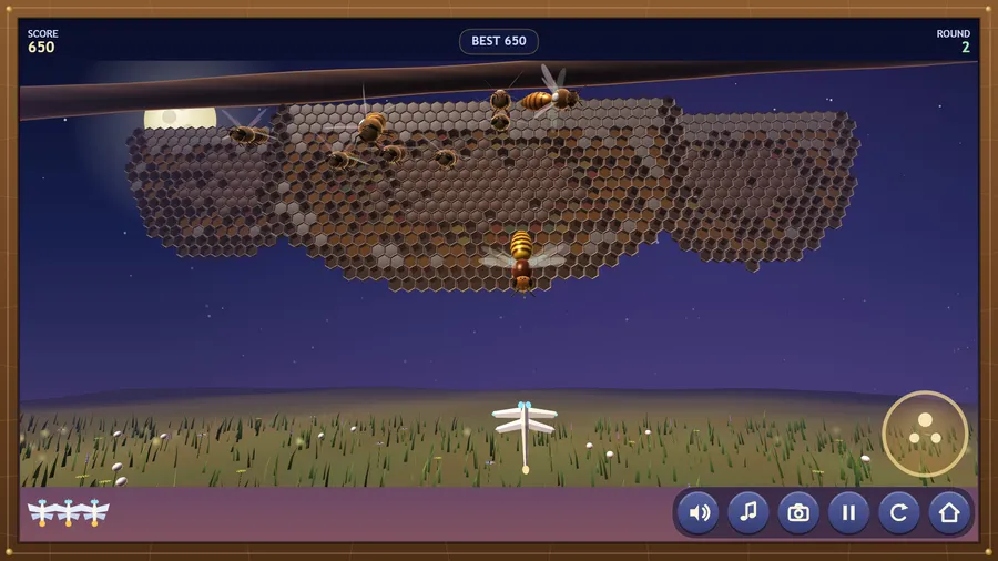 Round 2: a glossy hornet stoops out of the dusk at the origami dragonfly, the bee swarm parked on the comb behind it