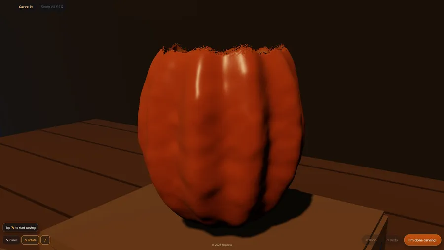The pumpkin with its top cut off and a ragged rim, ready to carve, with Carve, Rotate and I'm done carving! buttons