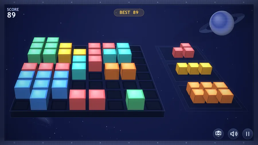 The low view at the grid: the cubes standing up in front, red, yellow and orange pieces waiting in the tray; score 89