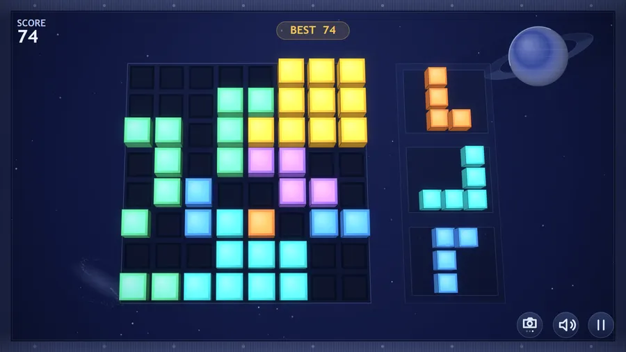 From above: the grid seen nearly straight down, every cell square, orange, cyan and blue pieces in the tray; score 74