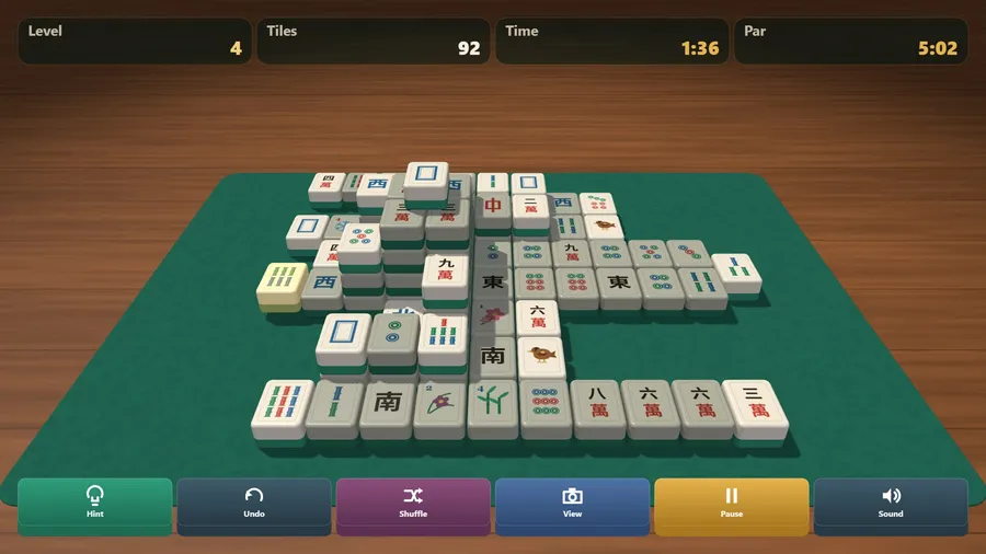 The close camera, low over the table: stacked tiles with jade backs throwing shadows, 92 left, one tile selected