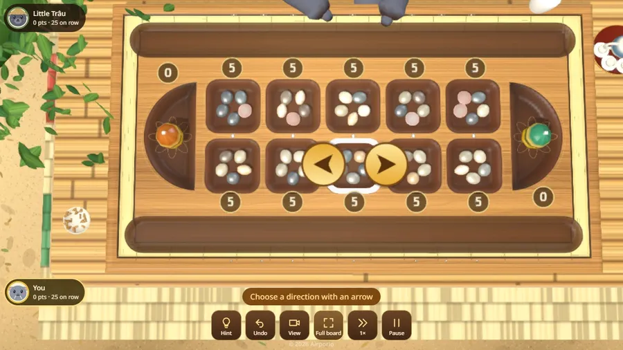 The whole board from above, with a pit chosen and two arrows to pick the direction of sowing.