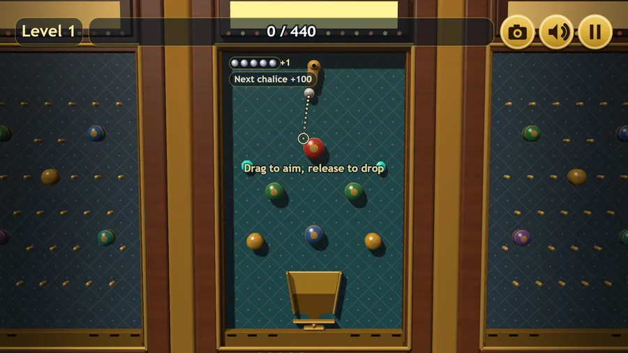 Hall 1: a steel marble at the brass chute, dotted aim guide ringing the first bumper, lacquered bumpers above a gold chalice