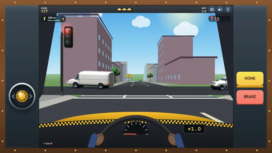 From the driver's seat at a red light: the wheel and hands, the yellow bonnet, a van crossing the junction ahead