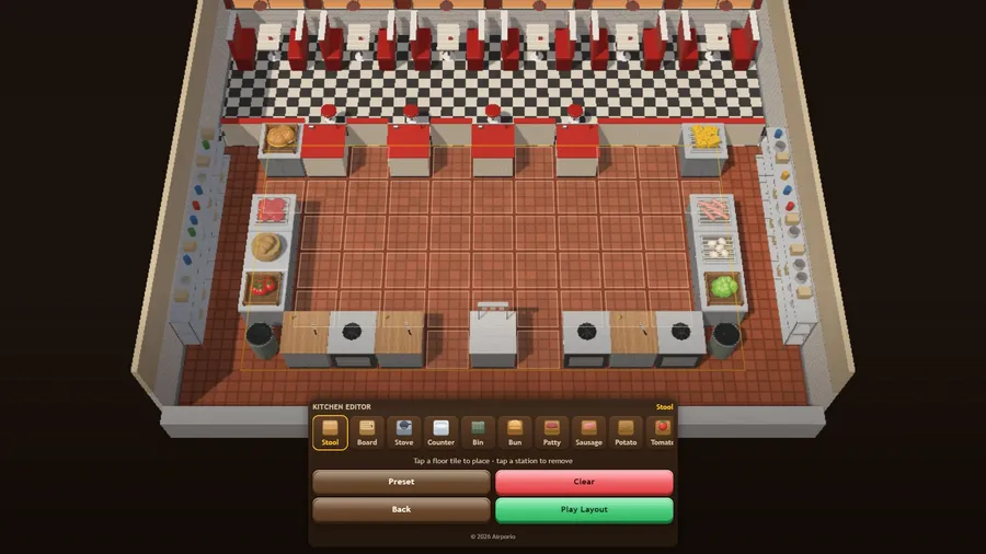 Kitchen Editor: the 3D kitchen with empty floor tiles outlined and a station palette below