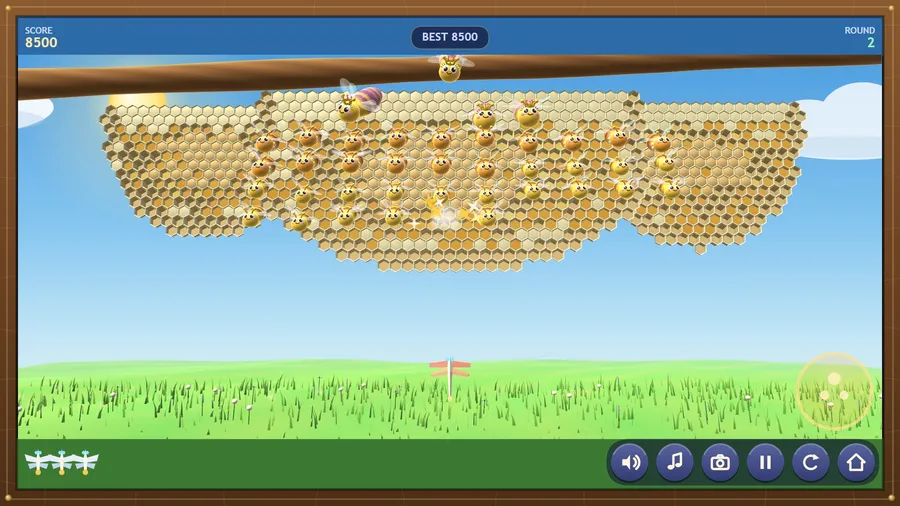 Round 2, classic view: smiling cartoon bees hover in formation before the comb; the paper dragonfly waits below; score 8500