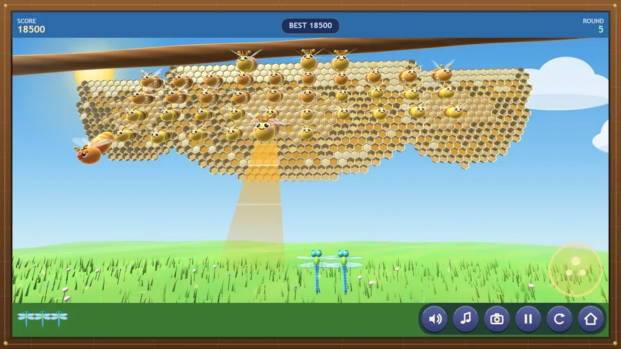 Close view, round 5: two blue dragonflies fly beside a queen's honey beam as the grumpy hornet bumbles past; score 18500