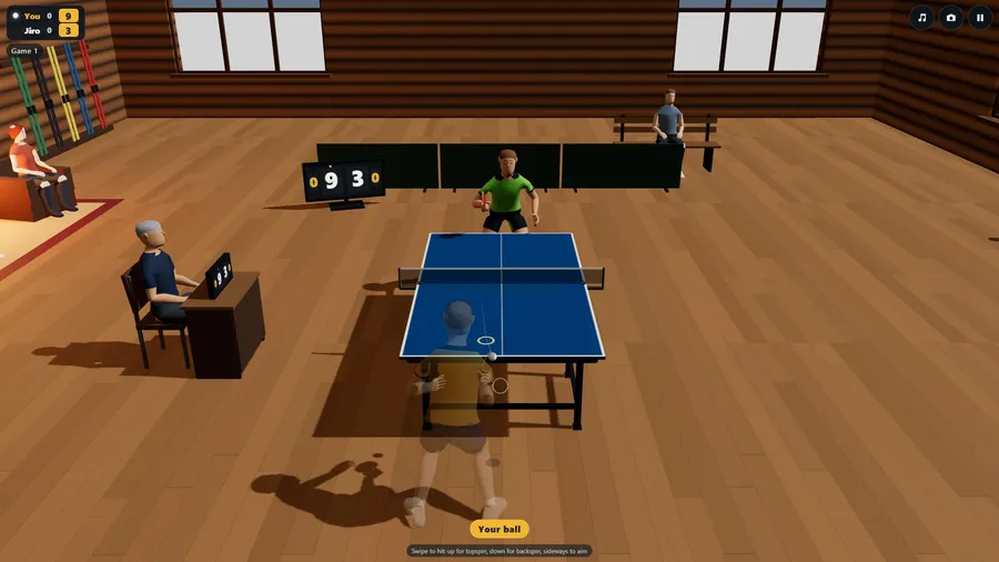 High and wide at The Lodge: a blue table in a log hall, your player about to play a forehand, 9-3 on the board.