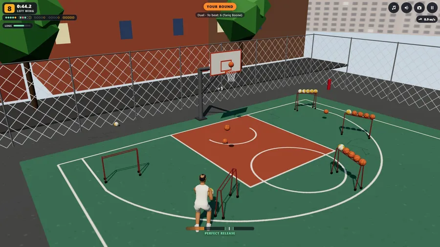 The city court from the television camera: your shooter at a rack on the left wing, his ball arriving at the ring.