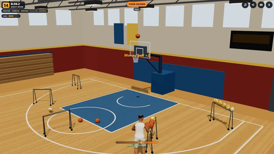 The practice gym from high behind your shooter: he lifts a ball off the rack, and another ball drops toward the ring.
